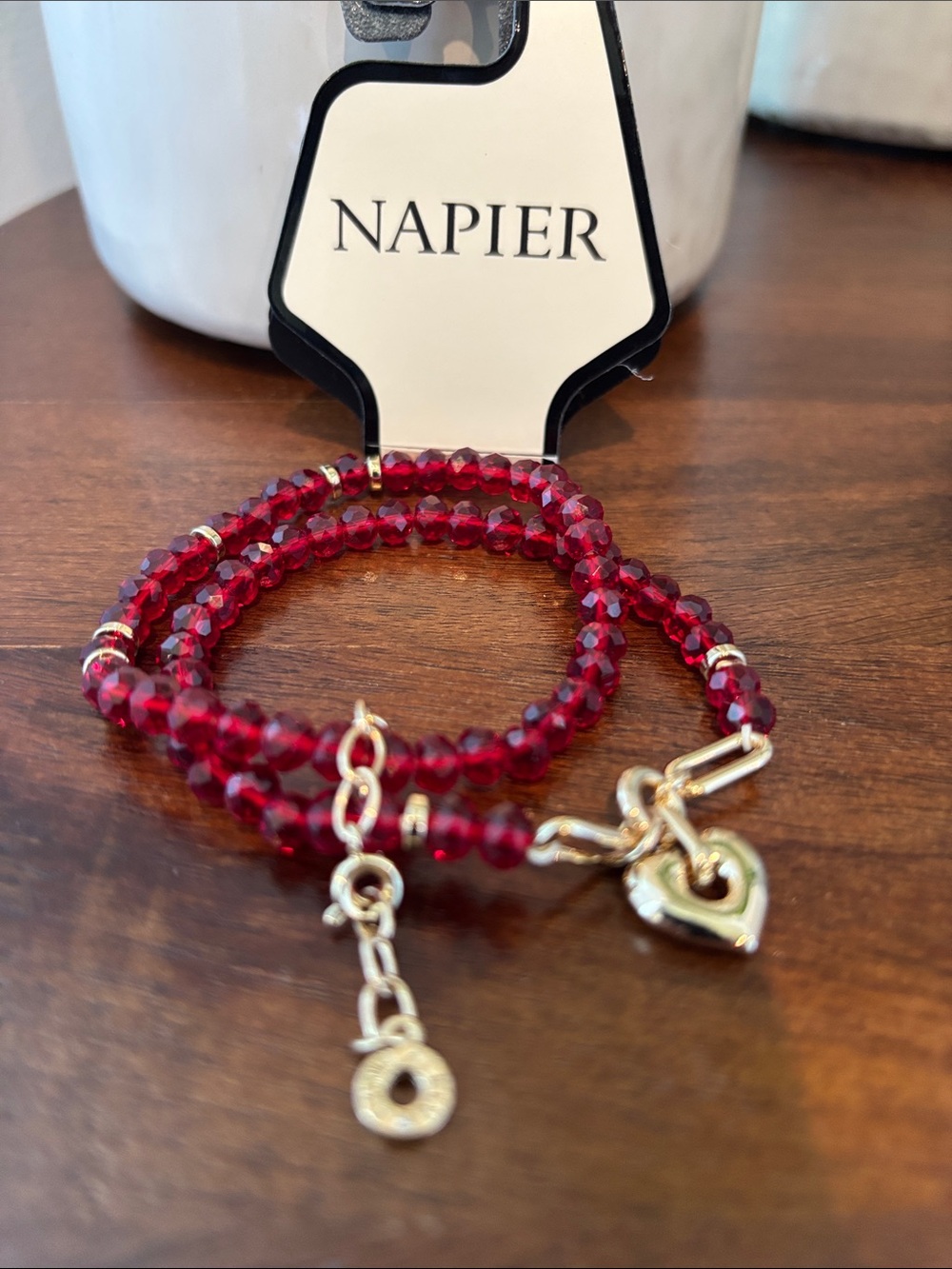 Napier Faceted strands of burgandy beads,
gold-tone heart charm,stretch